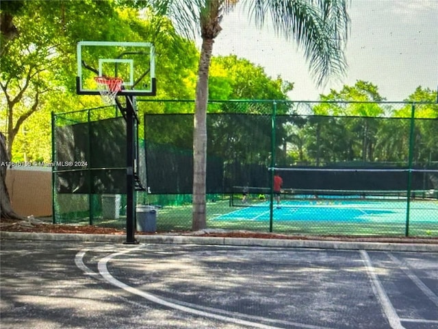 view of basketball court with tennis court