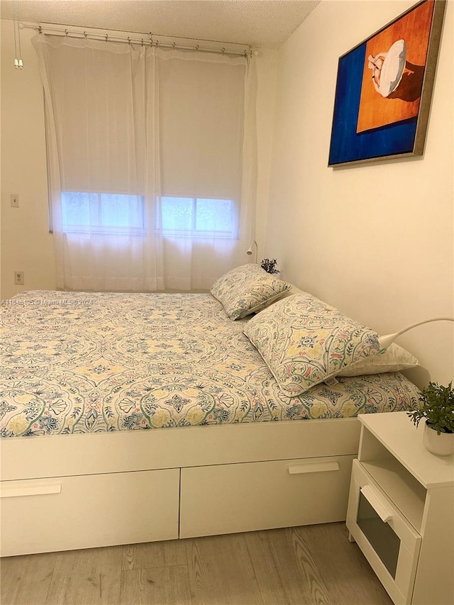 unfurnished bedroom featuring hardwood / wood-style flooring