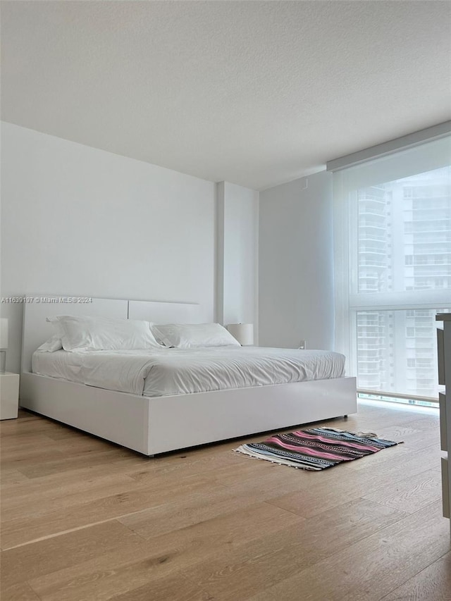 bedroom featuring light wood-type flooring