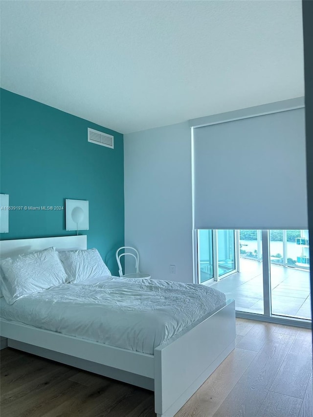 bedroom featuring hardwood / wood-style flooring