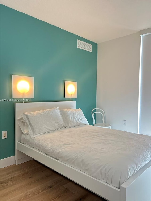 bedroom featuring hardwood / wood-style flooring