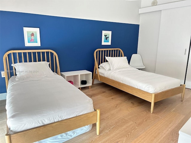 bedroom with light hardwood / wood-style flooring