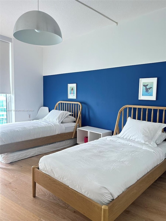 bedroom featuring wood-type flooring