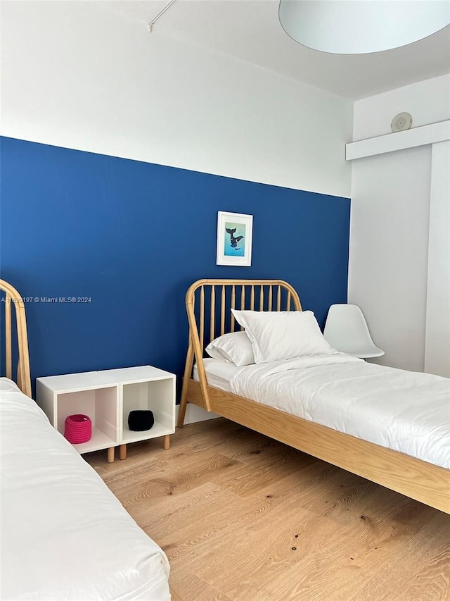 bedroom with light wood-type flooring