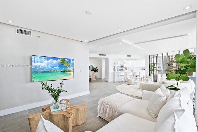 living room with floor to ceiling windows