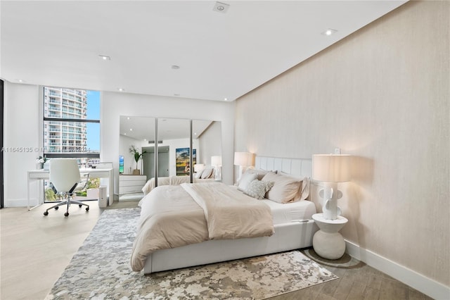 bedroom with light wood-type flooring