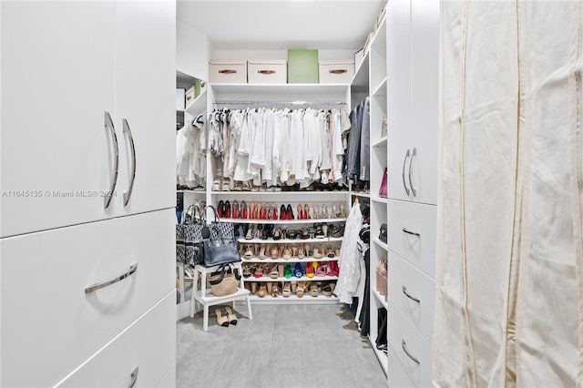 walk in closet featuring light tile patterned floors