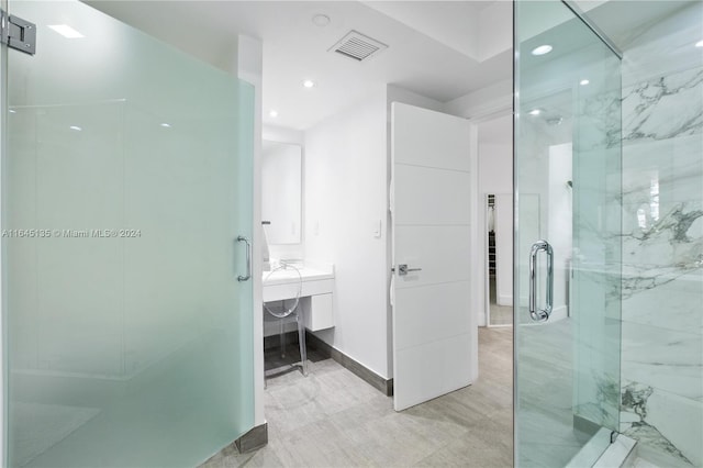 bathroom featuring tile patterned floors and walk in shower