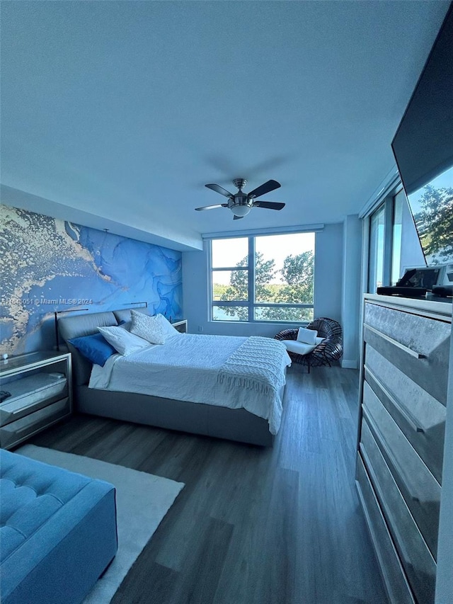 bedroom with hardwood / wood-style floors and ceiling fan