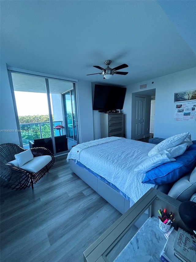 bedroom featuring ceiling fan and hardwood / wood-style flooring