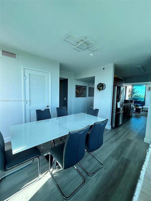 dining space featuring hardwood / wood-style floors