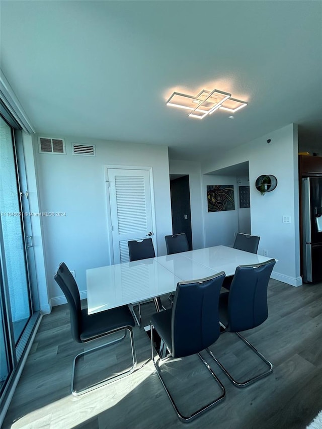 dining area featuring wood-type flooring