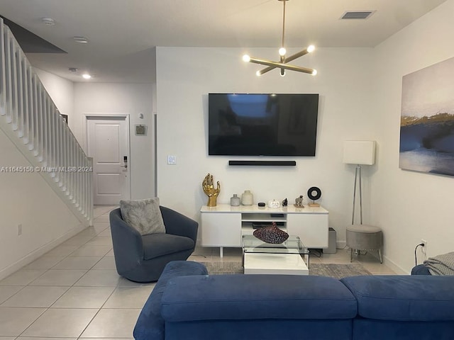 tiled living room featuring a notable chandelier