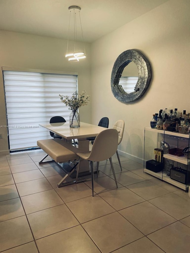 dining room featuring dark tile patterned floors