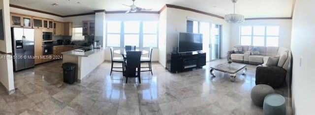 tiled living room featuring a notable chandelier and crown molding