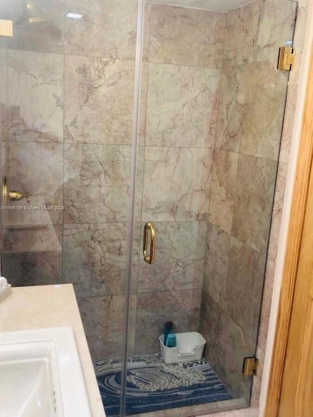 bathroom featuring an enclosed shower