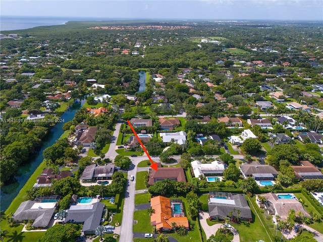 birds eye view of property with a water view