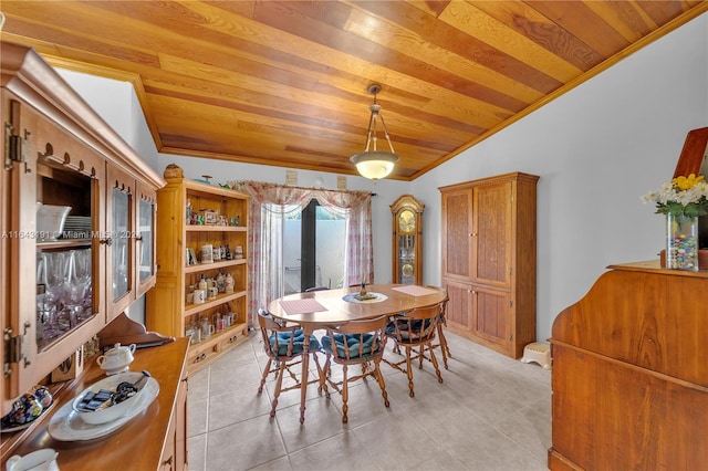 tiled dining space featuring wood ceiling and lofted ceiling