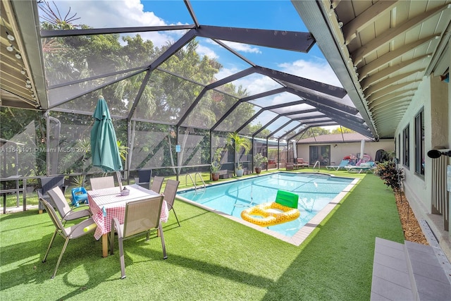 view of pool with a patio and a lanai