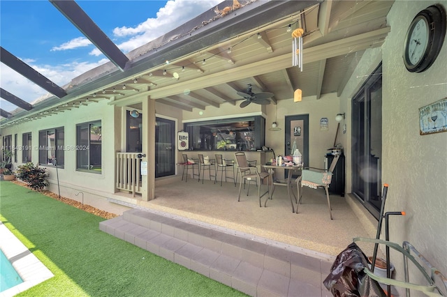 view of patio featuring ceiling fan