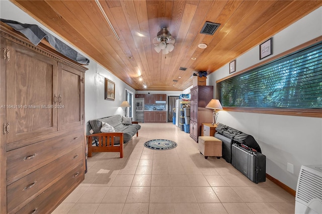 hall featuring light tile patterned flooring and wooden ceiling