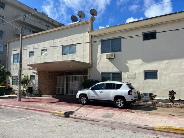8420 Byron Ave Unit 4, Miami Beach, FL 33141 - view of property featuring a wall mounted air conditioner