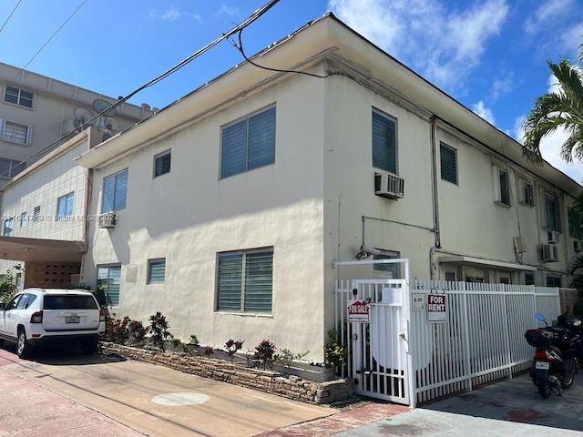 view of front of home with cooling unit