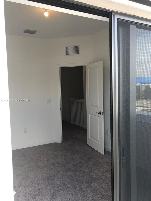 empty room featuring carpet floors