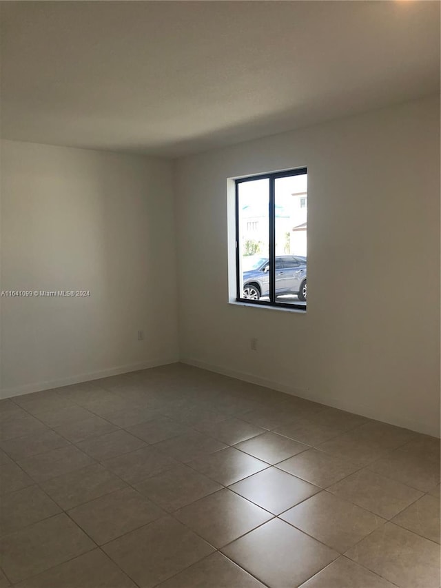 view of tiled spare room