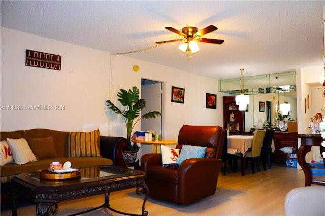 900 Saint Charles Pl Unit 316, Pembroke Pines, FL 33026 - living room featuring a ceiling fan, wood finished floors, and a textured ceiling