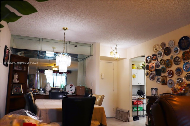 900 Saint Charles Pl Unit 316, Pembroke Pines, FL 33026 - dining area with a chandelier and a textured ceiling