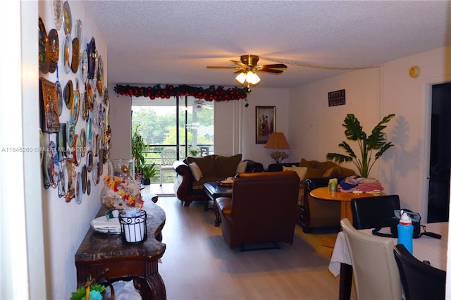 900 Saint Charles Pl Unit 316, Pembroke Pines, FL 33026 - living area featuring light wood-style floors, a ceiling fan, and a textured ceiling