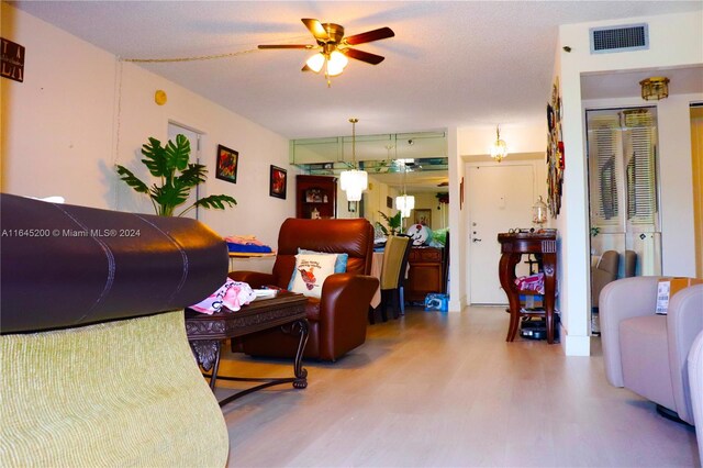 900 Saint Charles Pl Unit 316, Pembroke Pines, FL 33026 - living area with wood finished floors and a ceiling fan