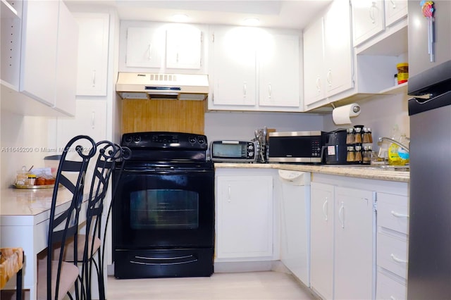 900 Saint Charles Pl Unit 316, Pembroke Pines, FL 33026 - kitchen featuring exhaust hood, appliances with stainless steel finishes, light countertops, and white cabinetry