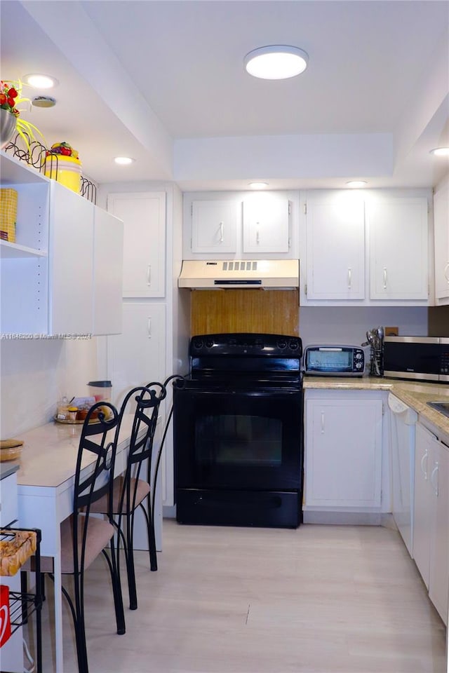 900 Saint Charles Pl Unit 316, Pembroke Pines, FL 33026 - kitchen featuring black range with electric cooktop, under cabinet range hood, stainless steel microwave, white cabinetry, and light countertops