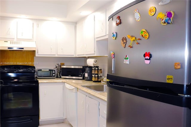900 Saint Charles Pl Unit 316, Pembroke Pines, FL 33026 - kitchen featuring stainless steel appliances, custom range hood, light countertops, and white cabinetry