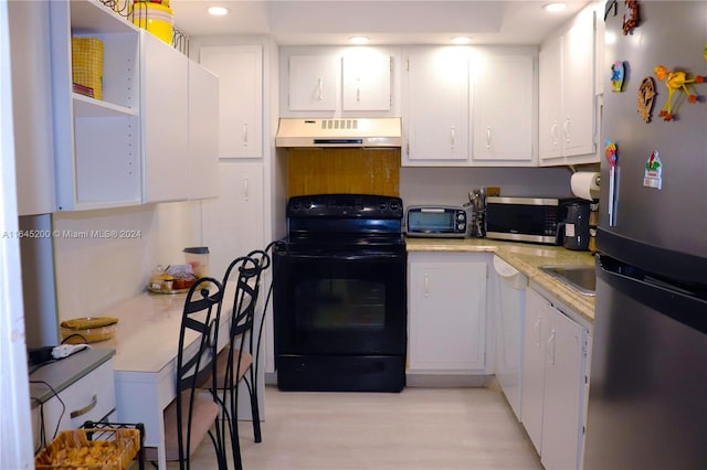 900 Saint Charles Pl Unit 316, Pembroke Pines, FL 33026 - kitchen with appliances with stainless steel finishes, custom range hood, white cabinetry, light wood-style floors, and recessed lighting