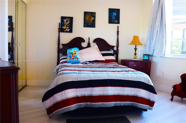 900 Saint Charles Pl Unit 316, Pembroke Pines, FL 33026 - bedroom featuring wood finished floors and baseboards