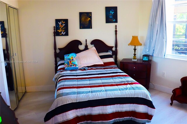 900 Saint Charles Pl Unit 316, Pembroke Pines, FL 33026 - bedroom featuring wood finished floors and baseboards