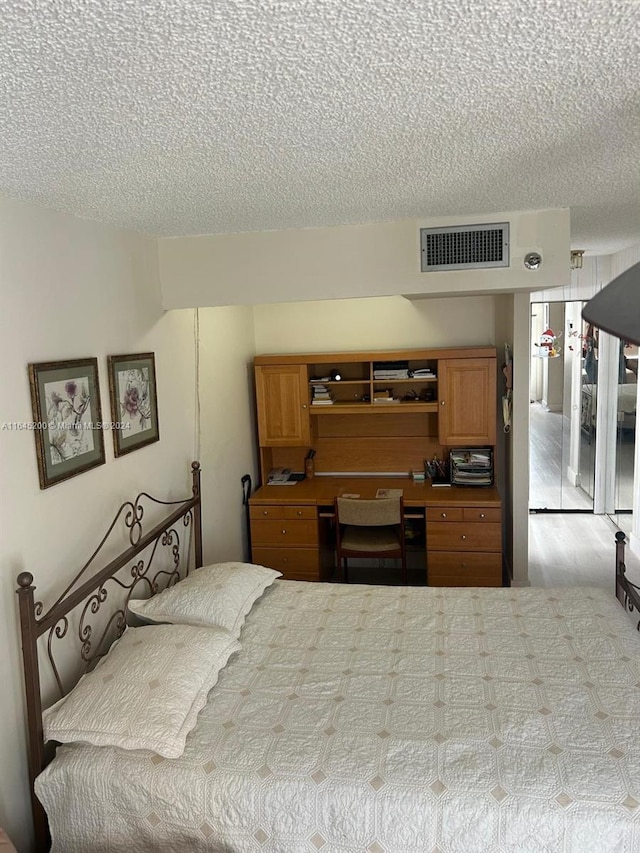 900 Saint Charles Pl Unit 316, Pembroke Pines, FL 33026 - bedroom featuring a textured ceiling and an office area