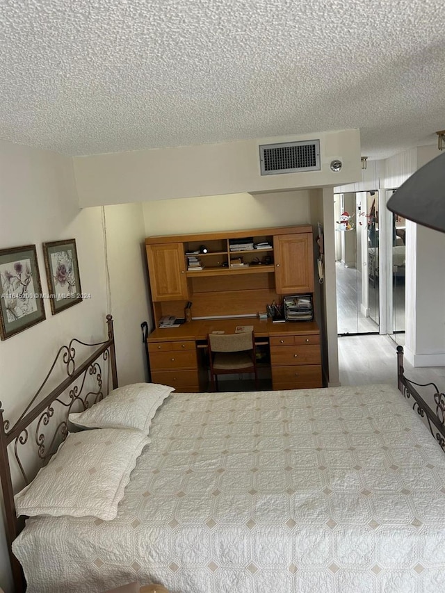 900 Saint Charles Pl Unit 316, Pembroke Pines, FL 33026 - bedroom featuring a textured ceiling