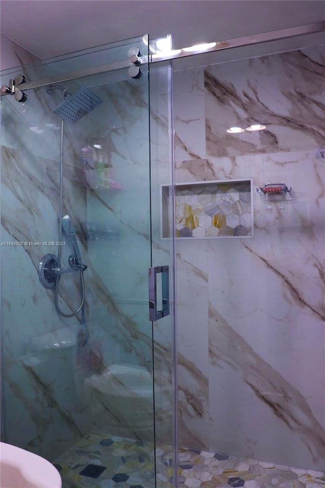 900 Saint Charles Pl Unit 316, Pembroke Pines, FL 33026 - full bathroom featuring a marble finish shower and toilet