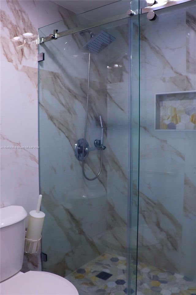 900 Saint Charles Pl Unit 316, Pembroke Pines, FL 33026 - full bathroom with a marble finish shower and toilet