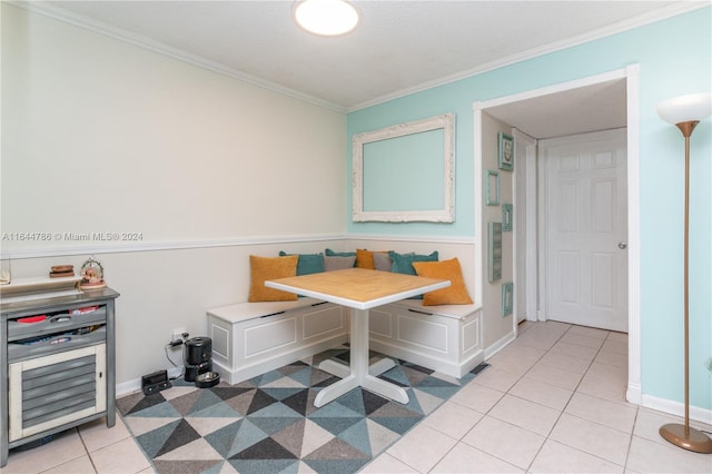 interior space with ornamental molding and light tile patterned floors