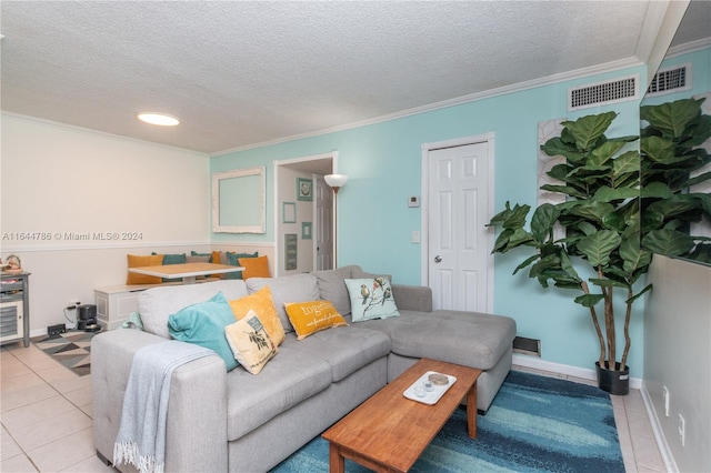 living room featuring a textured ceiling, crown molding, and light tile patterned flooring