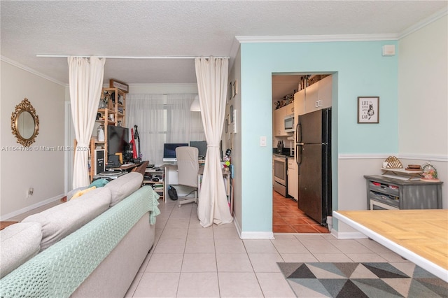 interior space featuring light tile patterned flooring, ornamental molding, and a textured ceiling