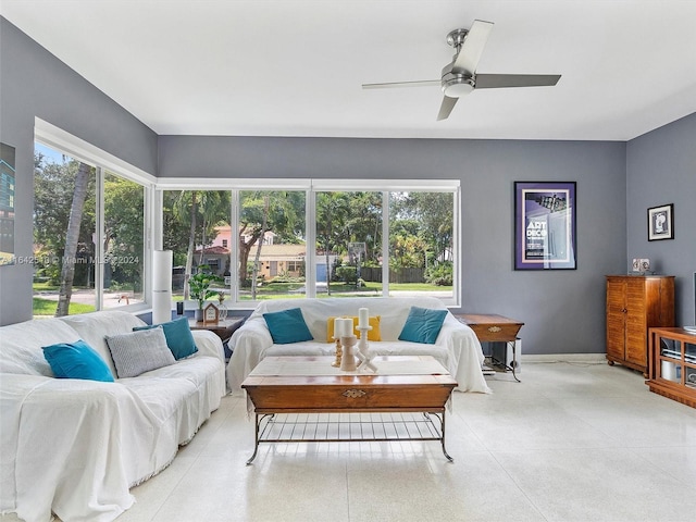 living room featuring ceiling fan and plenty of natural light