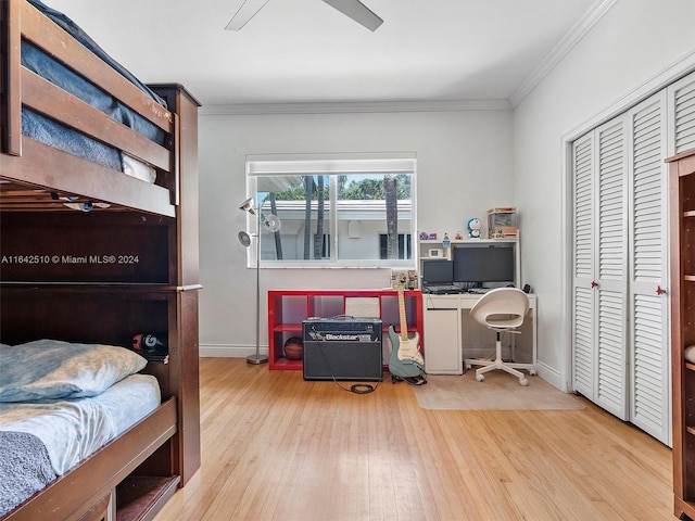 bedroom with a closet, ceiling fan, light hardwood / wood-style flooring, and crown molding