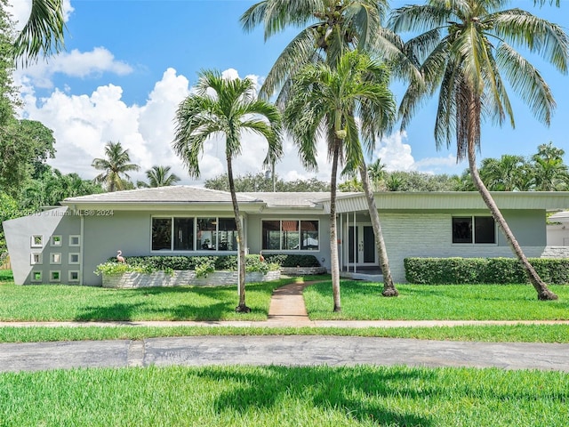 ranch-style house with a front yard