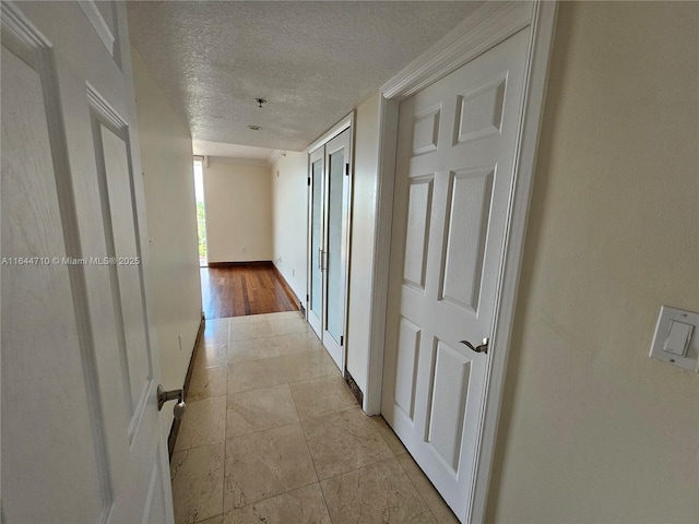 1650 Coral Way Unit 601, Miami, FL 33145 - corridor with a textured ceiling and light tile patterned floors